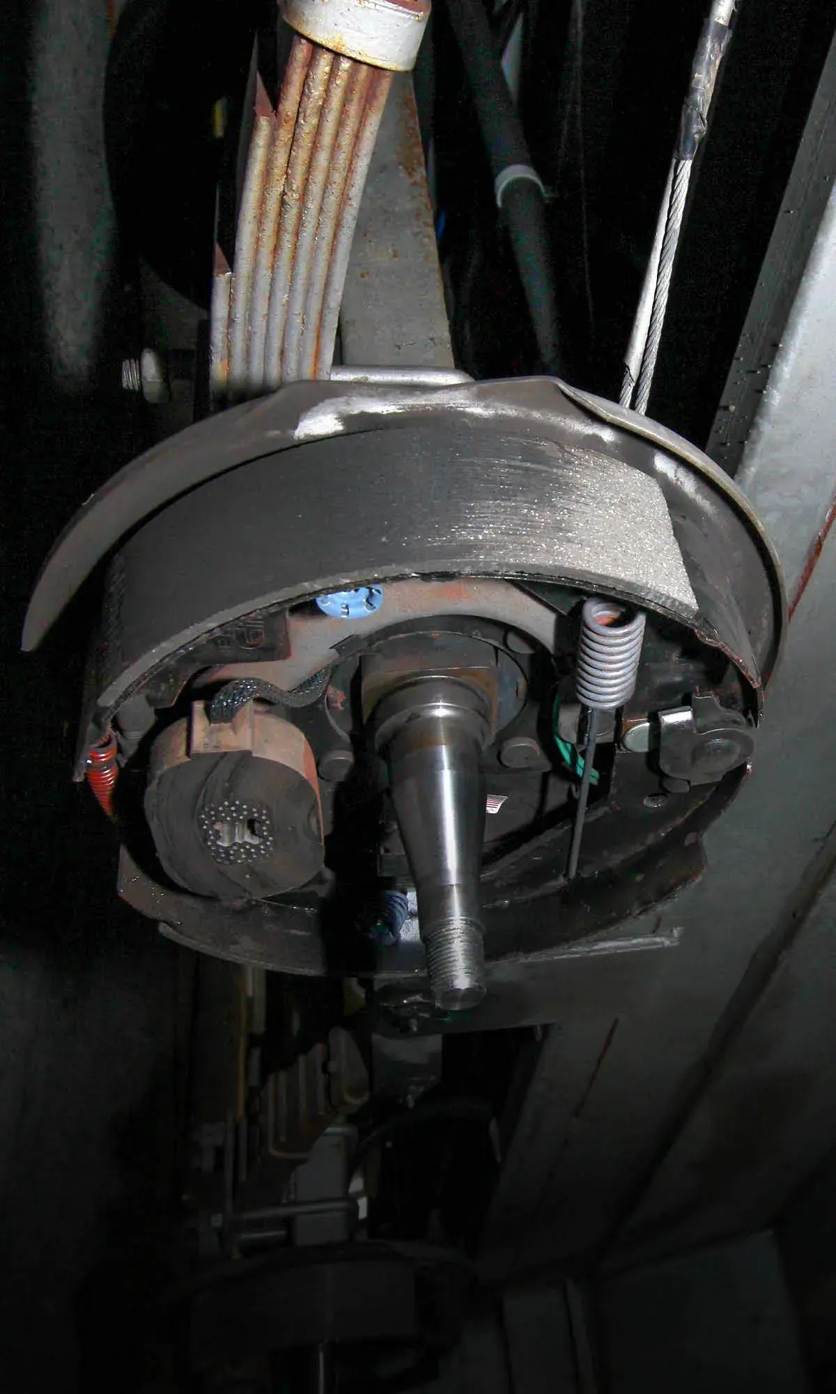 A Close Up Of A Brake Caliper On A Train — Affordable Caravan Repairs in Bundaberg, QLD