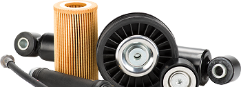 Car parts including a filter and a pulley on a white background. | Auto Source Of West Michigan
