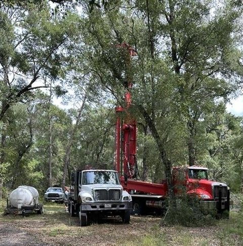A room with a lot of pipes and a tank