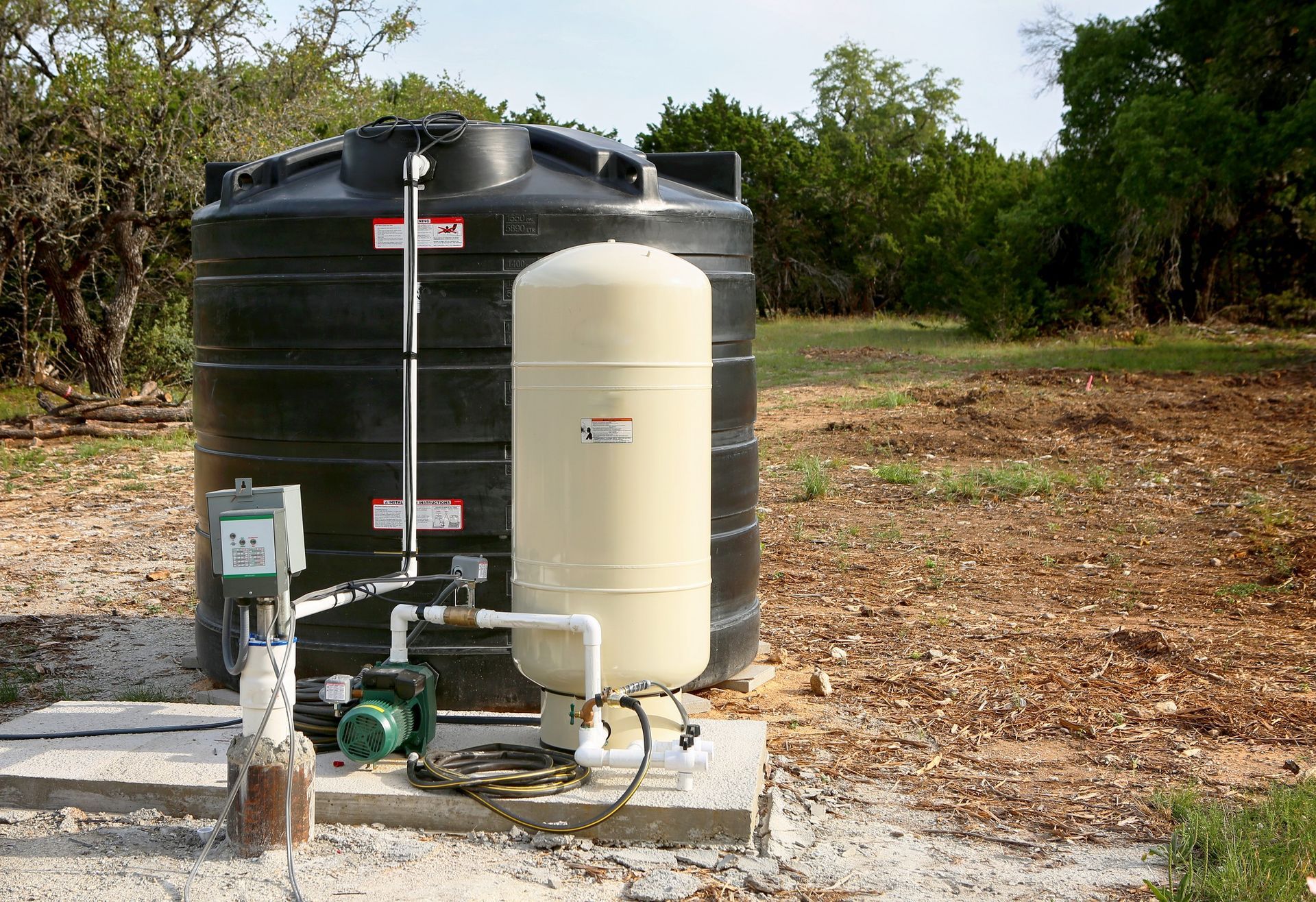 A water tank with a pump attached to it