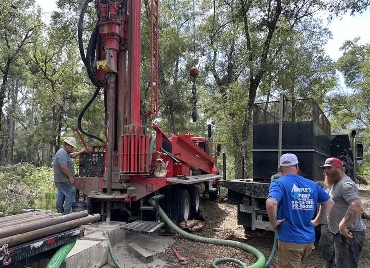 A water tank with a pump attached to it