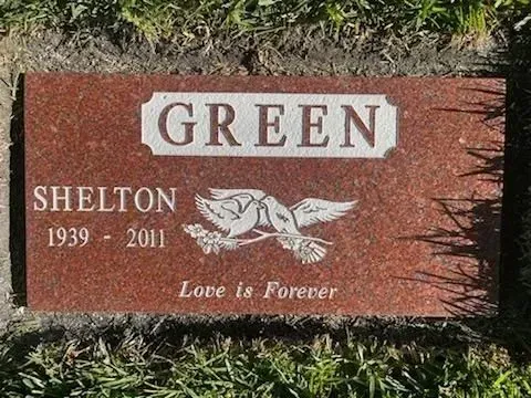 Red granite headstone with 