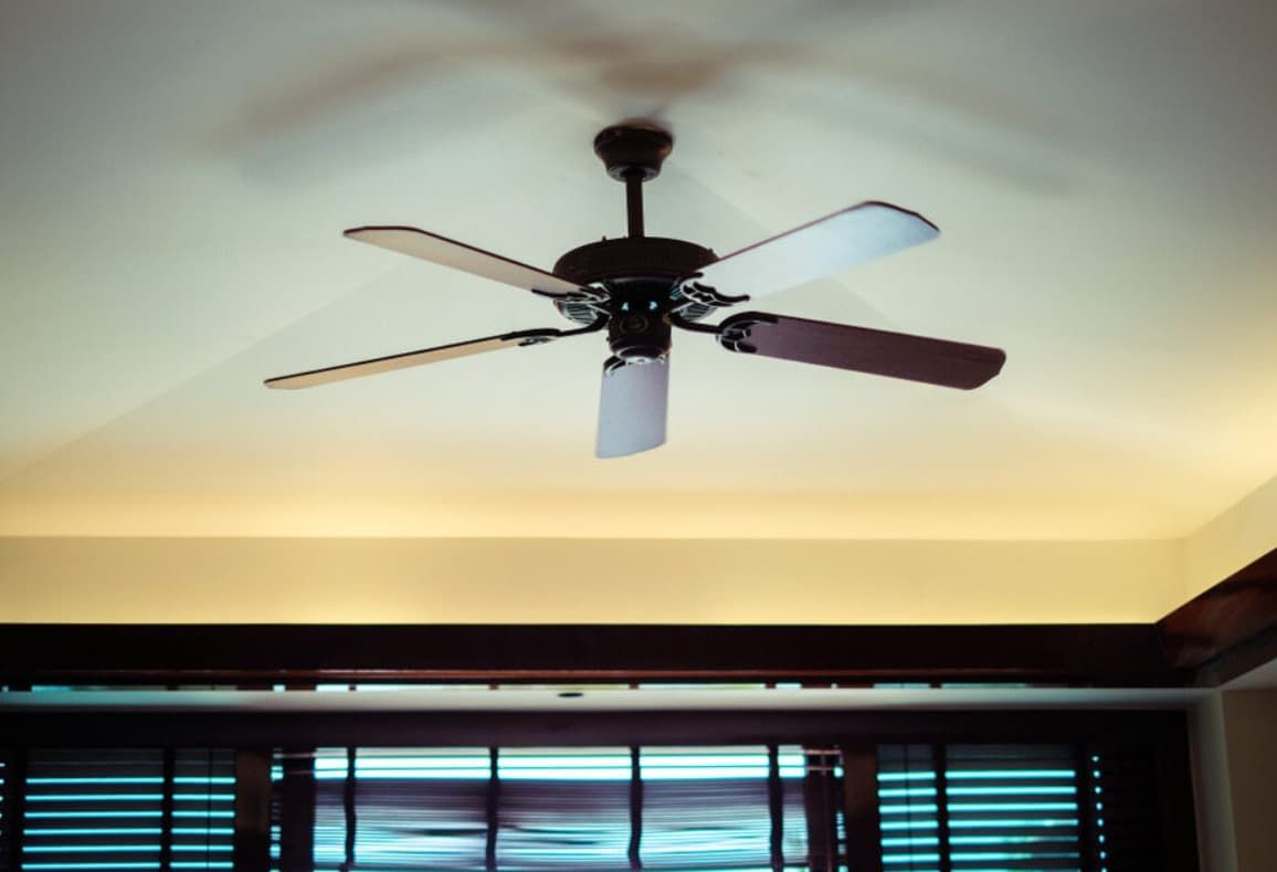 A Ceiling Fan Is Hanging From The Ceiling Of A Room — Mozzlec Electrical In Urangan, QLD