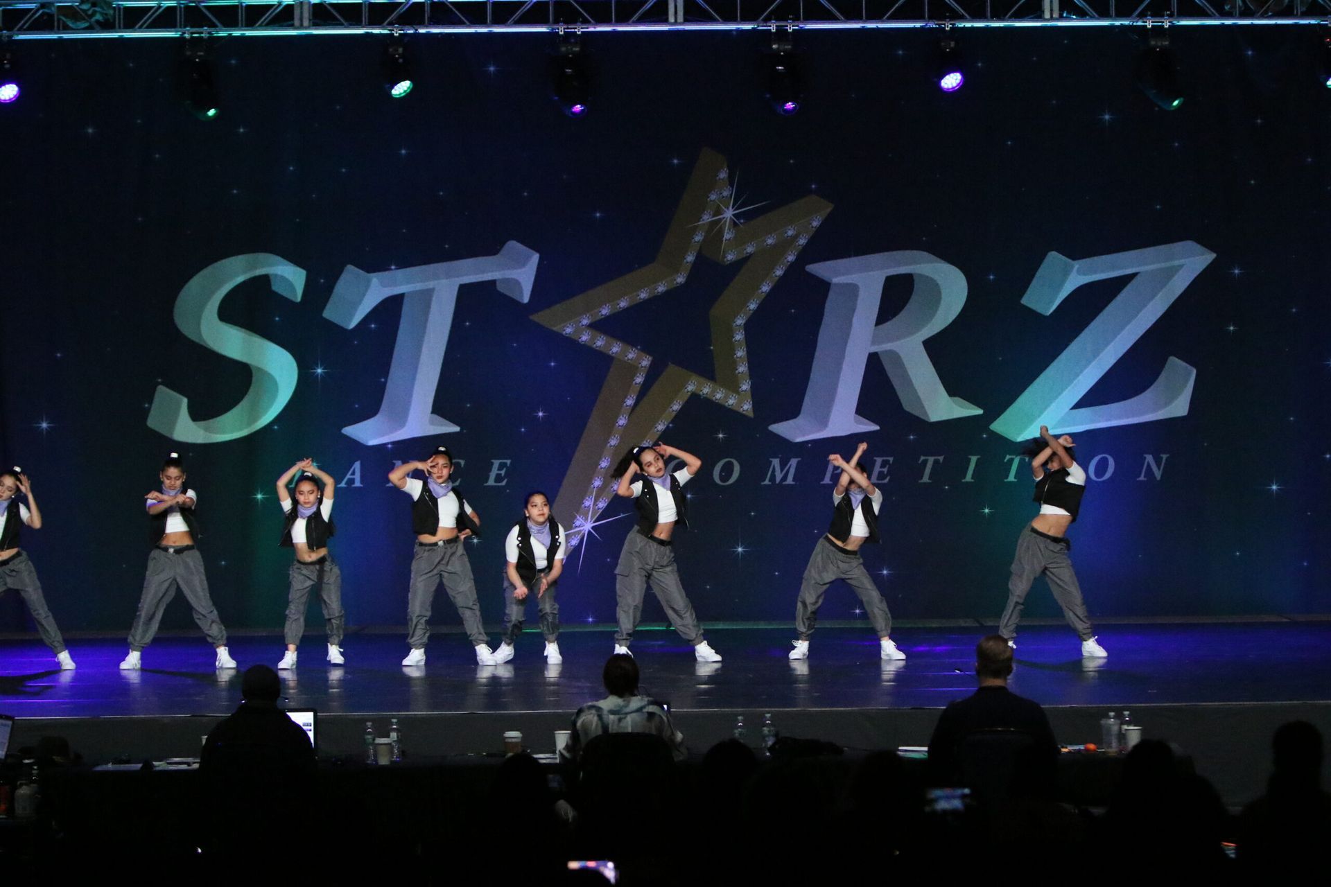 A group of people are dancing on a stage in front of a starz logo
