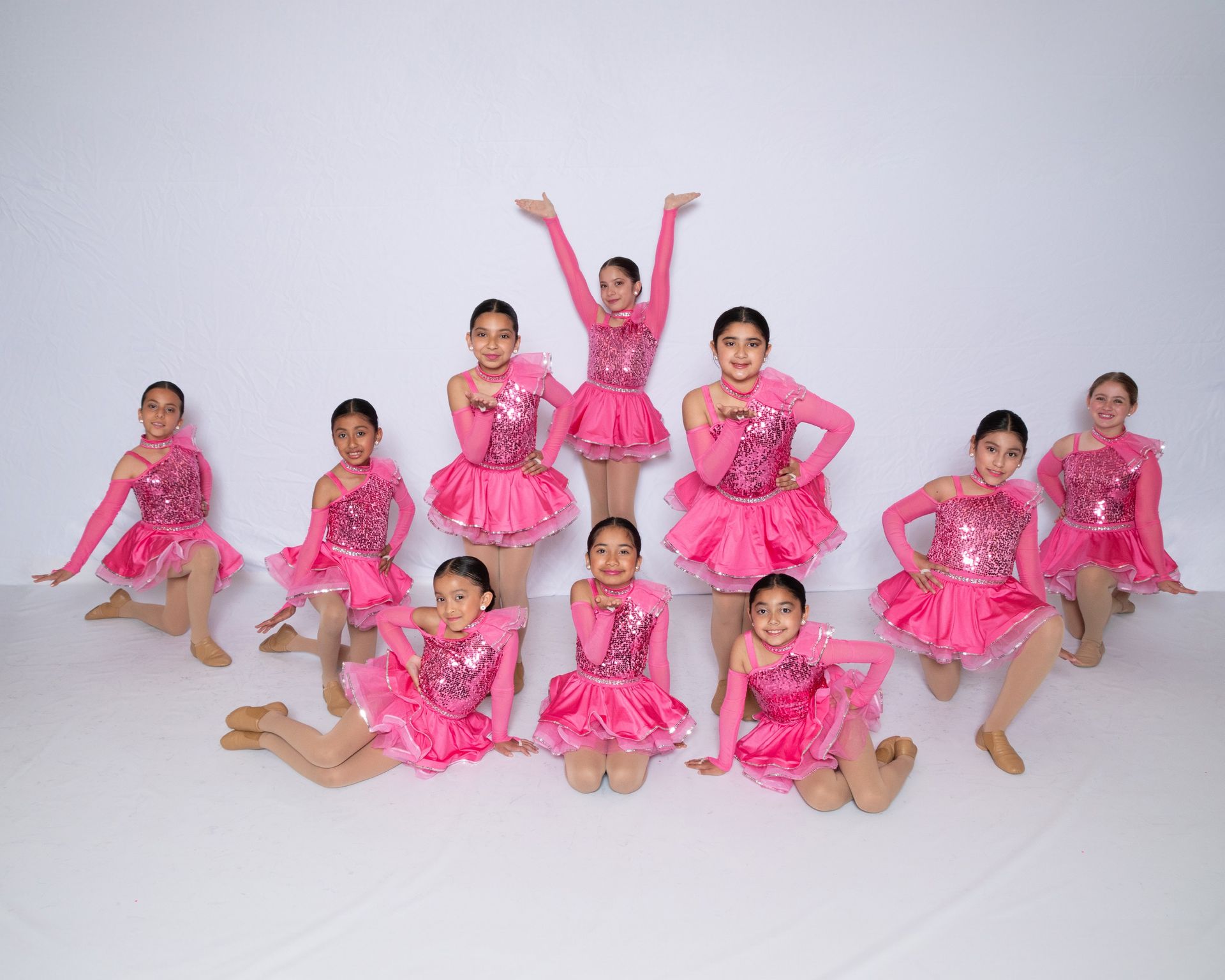 A group of children are posing for a picture in a black and white photo.