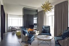 A living room filled with furniture and a fireplace.