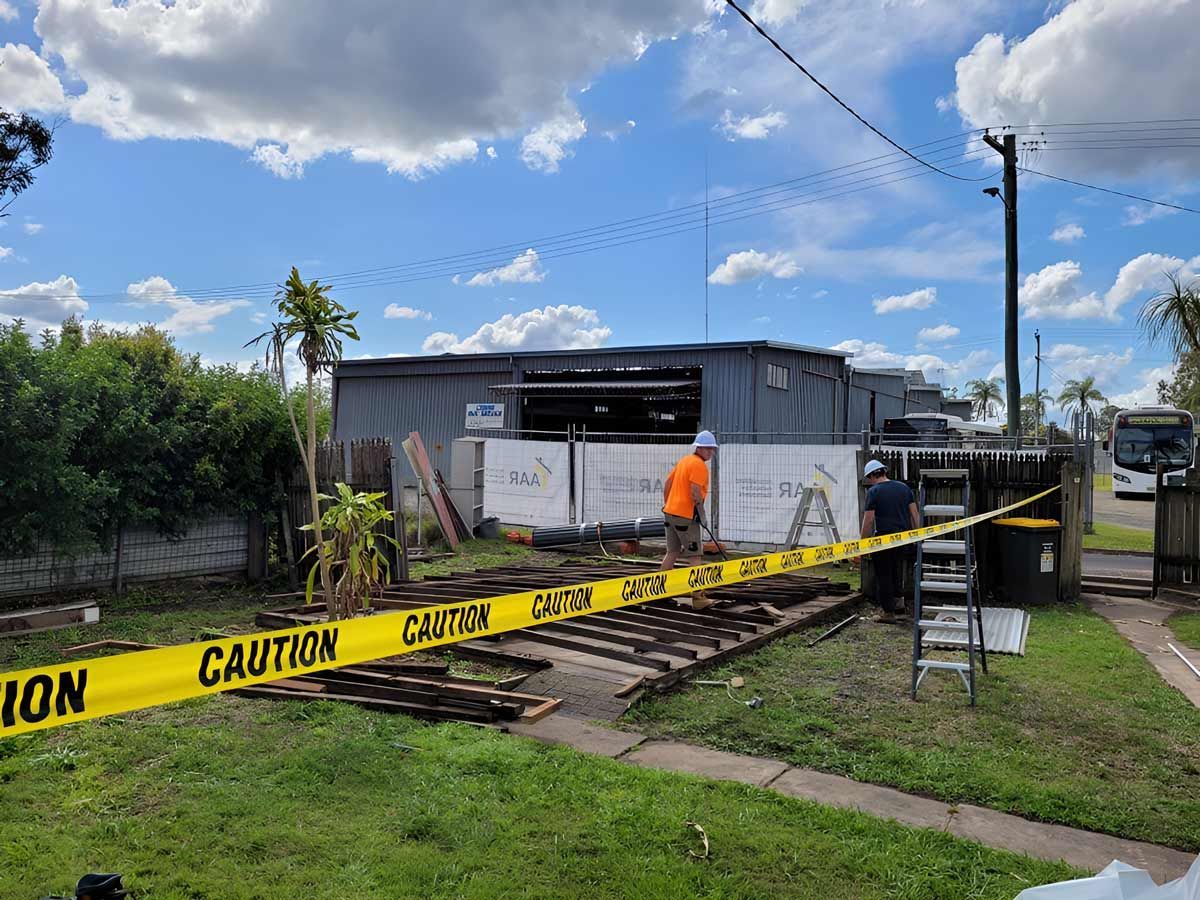 A Construction Site With A Caution Tape Around It — Accredited Asbestos Removers in Lismore, NSW