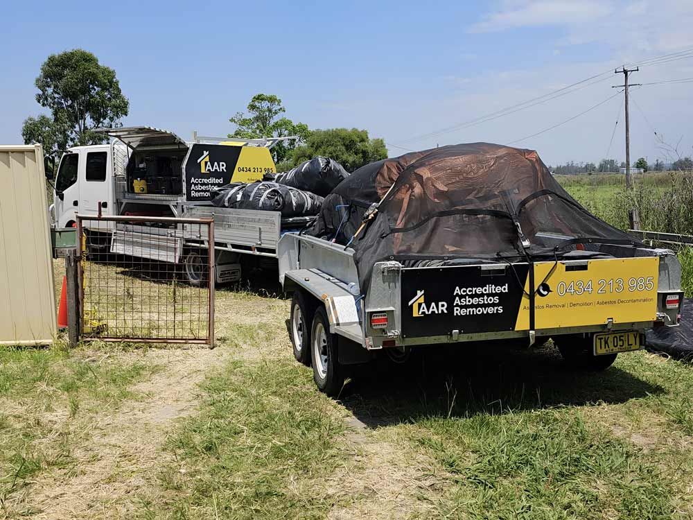 A Trailer Truck With Loaded Of Asbestos Remove — Accredited Asbestos Removers in Casino, NSW