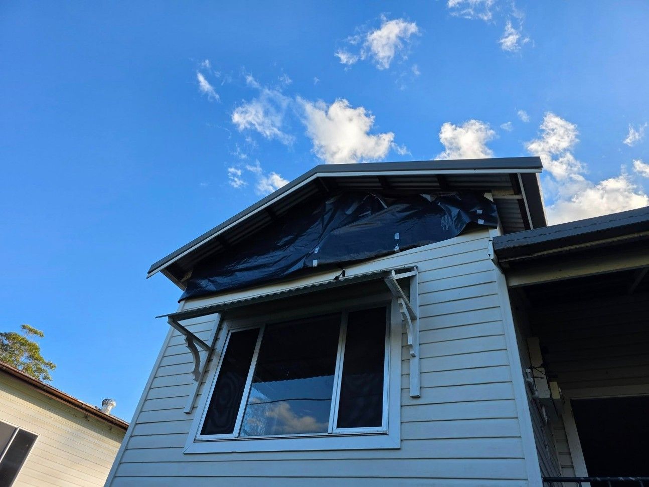 House With Dark Tarp Covering the Roof — Accredited Asbestos Removers in Ballina, NSW