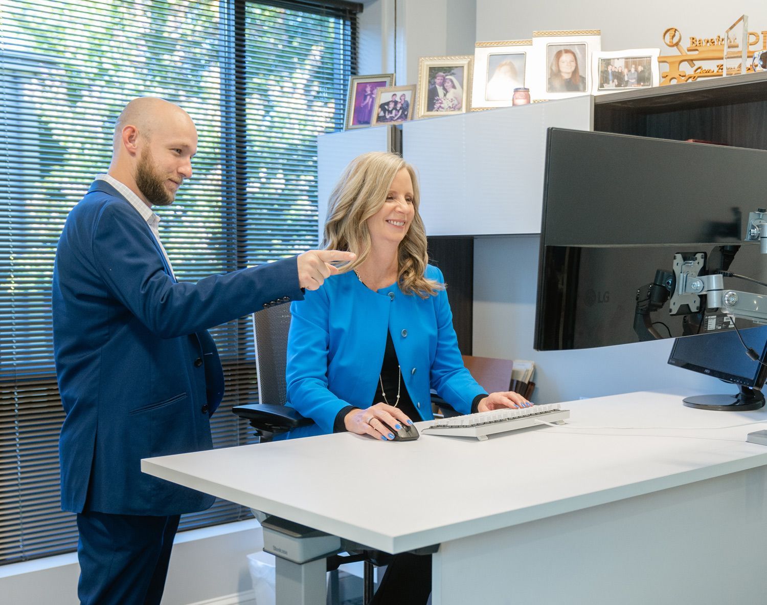 Two professionals discussing background check results in a modern office, highlighting efficiency and accuracy in fast background check services.