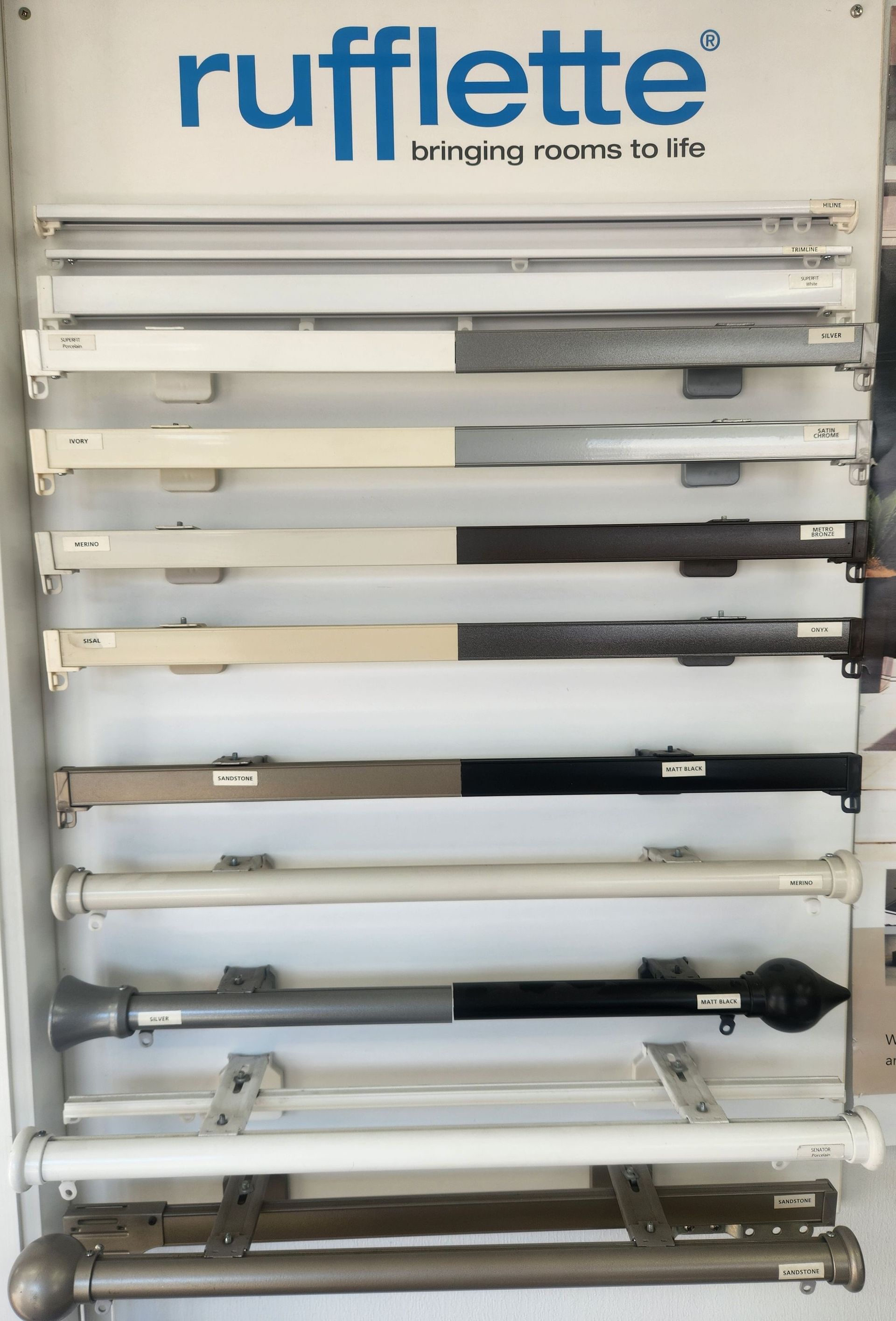 A display of rufflette curtain poles in different colors