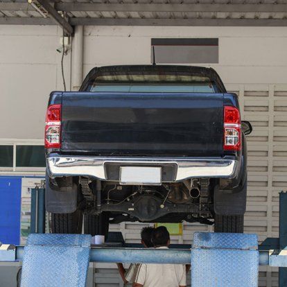 Auto mechanic repairing a car