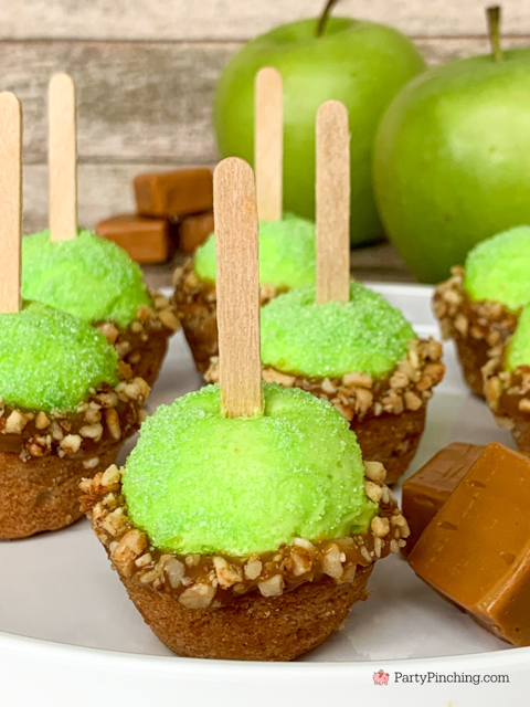 mini cake bites topped with neon green filling and caramel with nuts