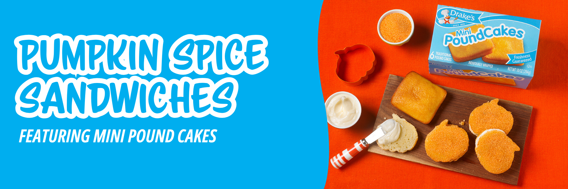 Blue banner promoting a box of Drake’s Mini Pound Cakes, orange sprinkles, a pumpkin cookie cutter, and frosted cake slices on a wooden board.