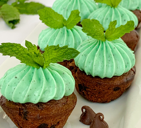 A white plate topped with three bunny shaped cookies