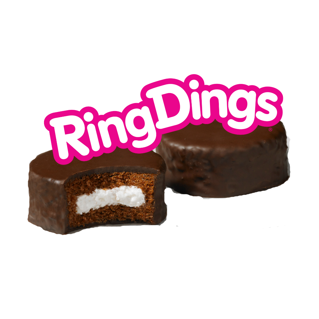 A close up of a ring dings cake with a bite taken out of it.