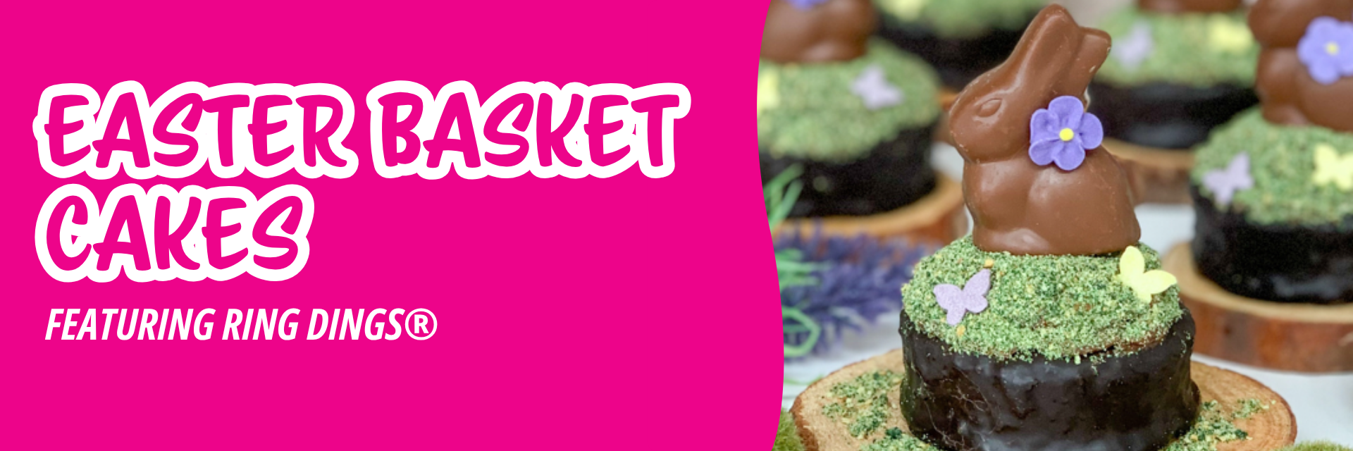 Pink banner promoting chocolate Easter treats with bunny figurines, purple flowers, and butterfly sprinkles on green coconut grass, on wood bases.