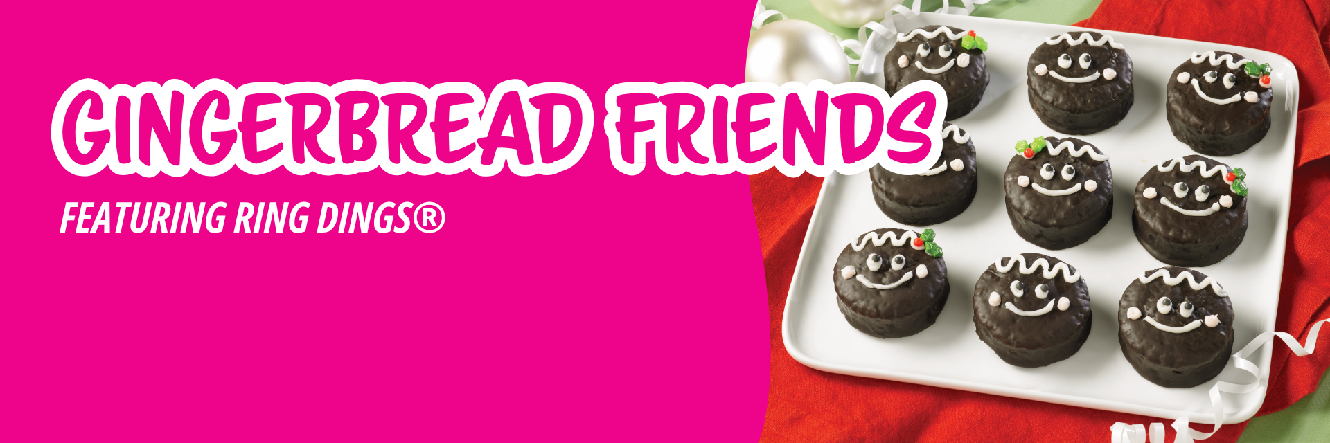 Pink banner promoting small round cakes decorated for school, featuring icing designs like lined notebook paper, rulers, and apples on a desk.