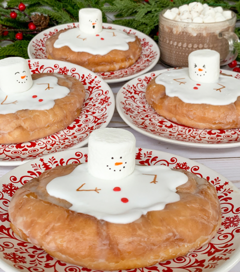honey buns with melted snowman decor on top