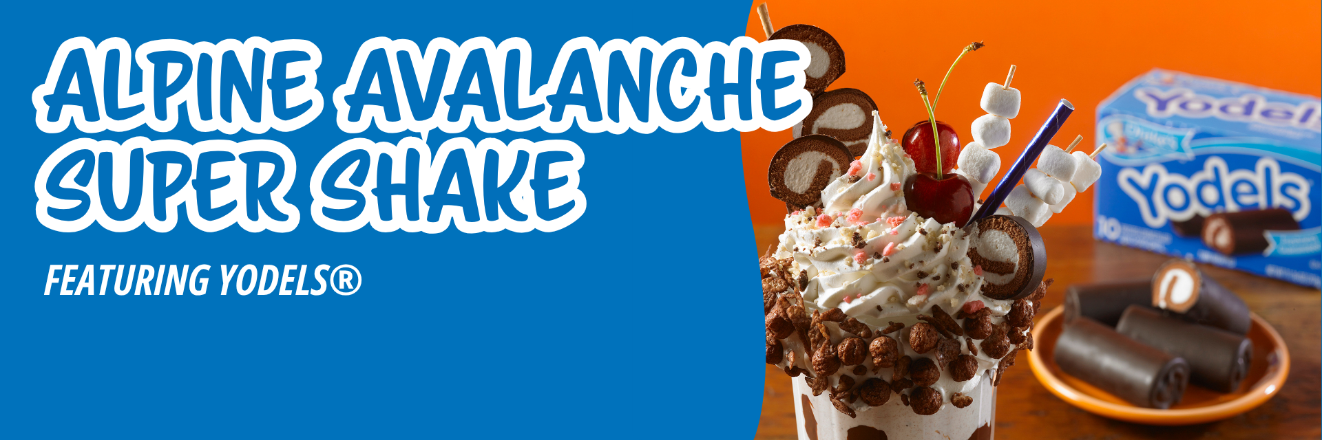 Blue banner promoting a milkshake made with ice cream, yodels, cherries, marshmallows and whipped cream