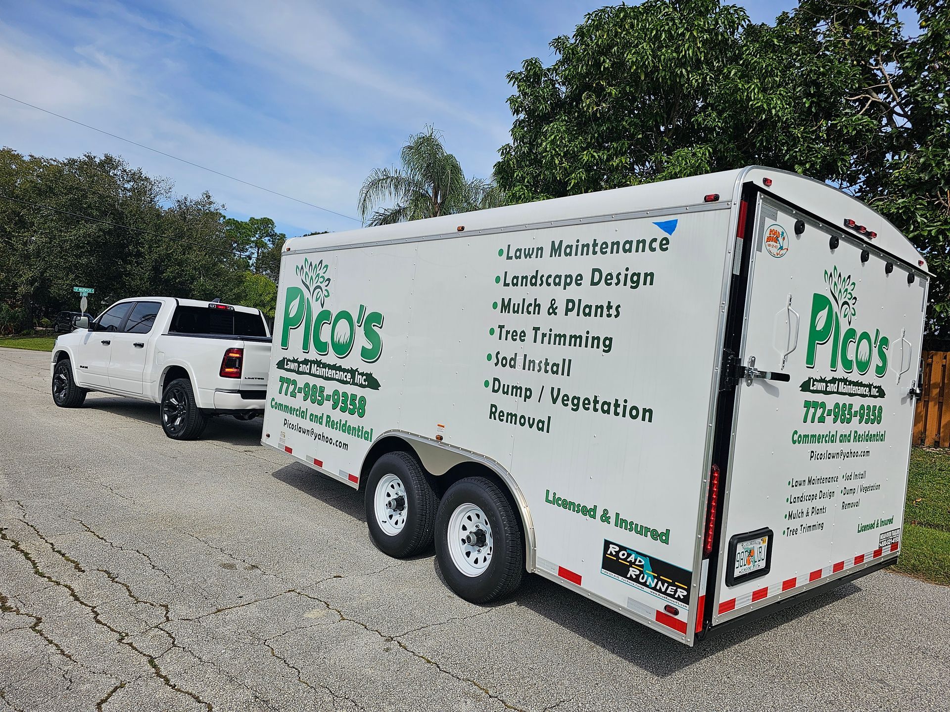 A white trailer with pico 's written on it is parked next to a white truck.