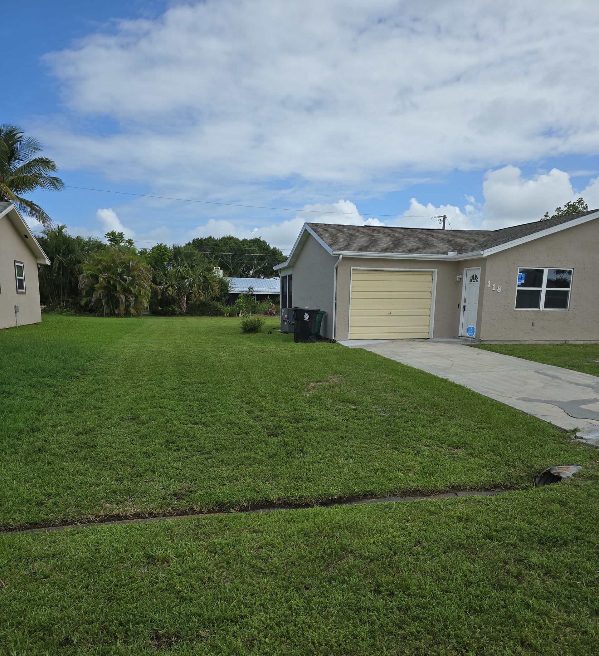 A house with a lot of grass in front of it
