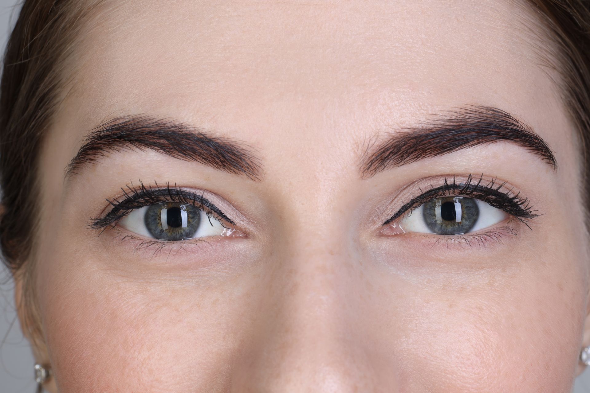 A close up of a woman 's eyes with mascara on.