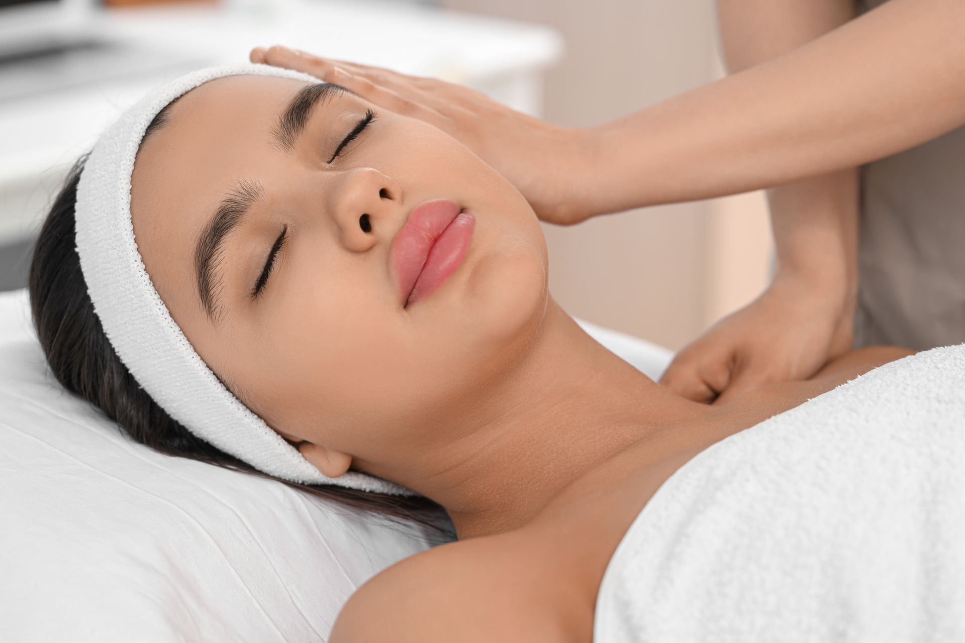 A woman is getting a massage at a spa.