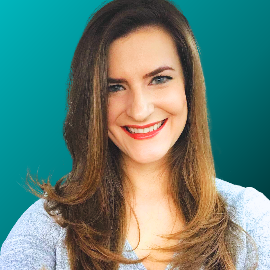 Meg Dean, Woman with long brown hair smiles widely, set against a teal background.