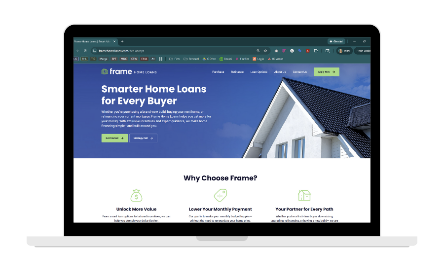 Laptop screen displaying a home loans website with a house photo and call to action button.