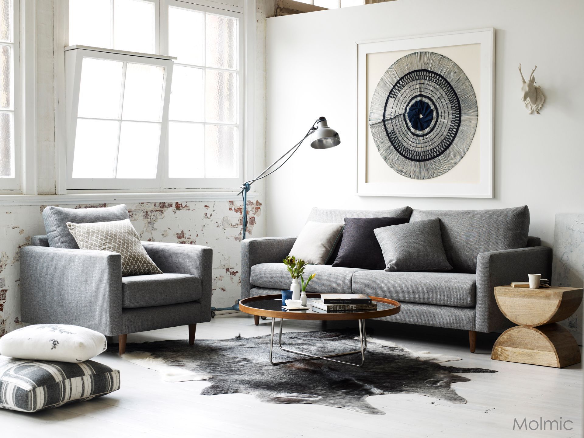 A Black Leather Chair and Ottoman Are in a Living Room — Envisage Furniture in Kialla, VIC
