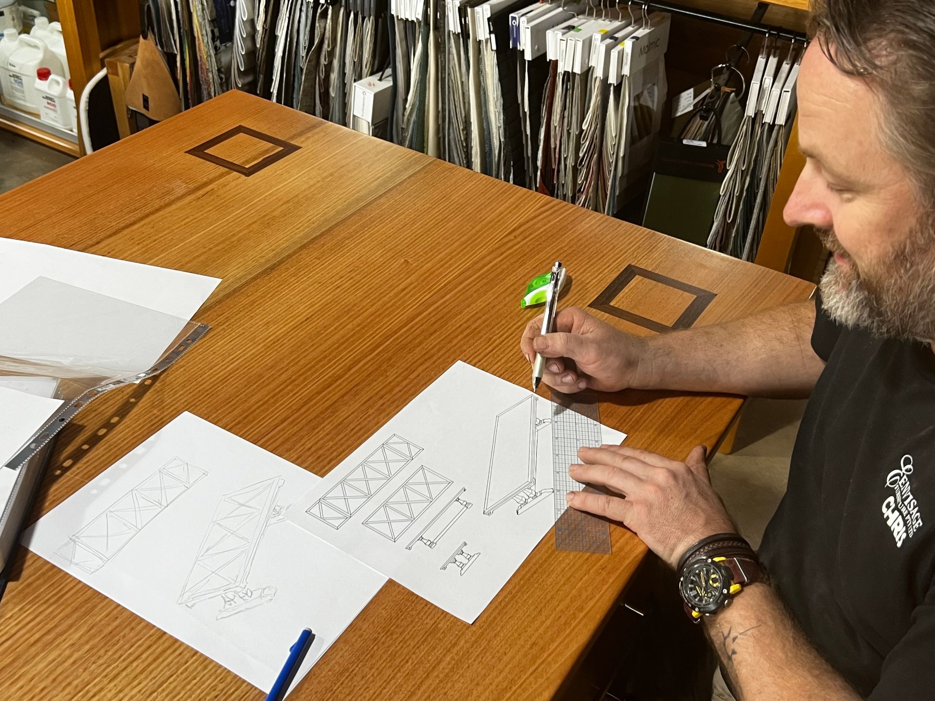 A Man is Working on a Piece of Wood in a Workshop — Envisage Furniture in Kialla, VIC