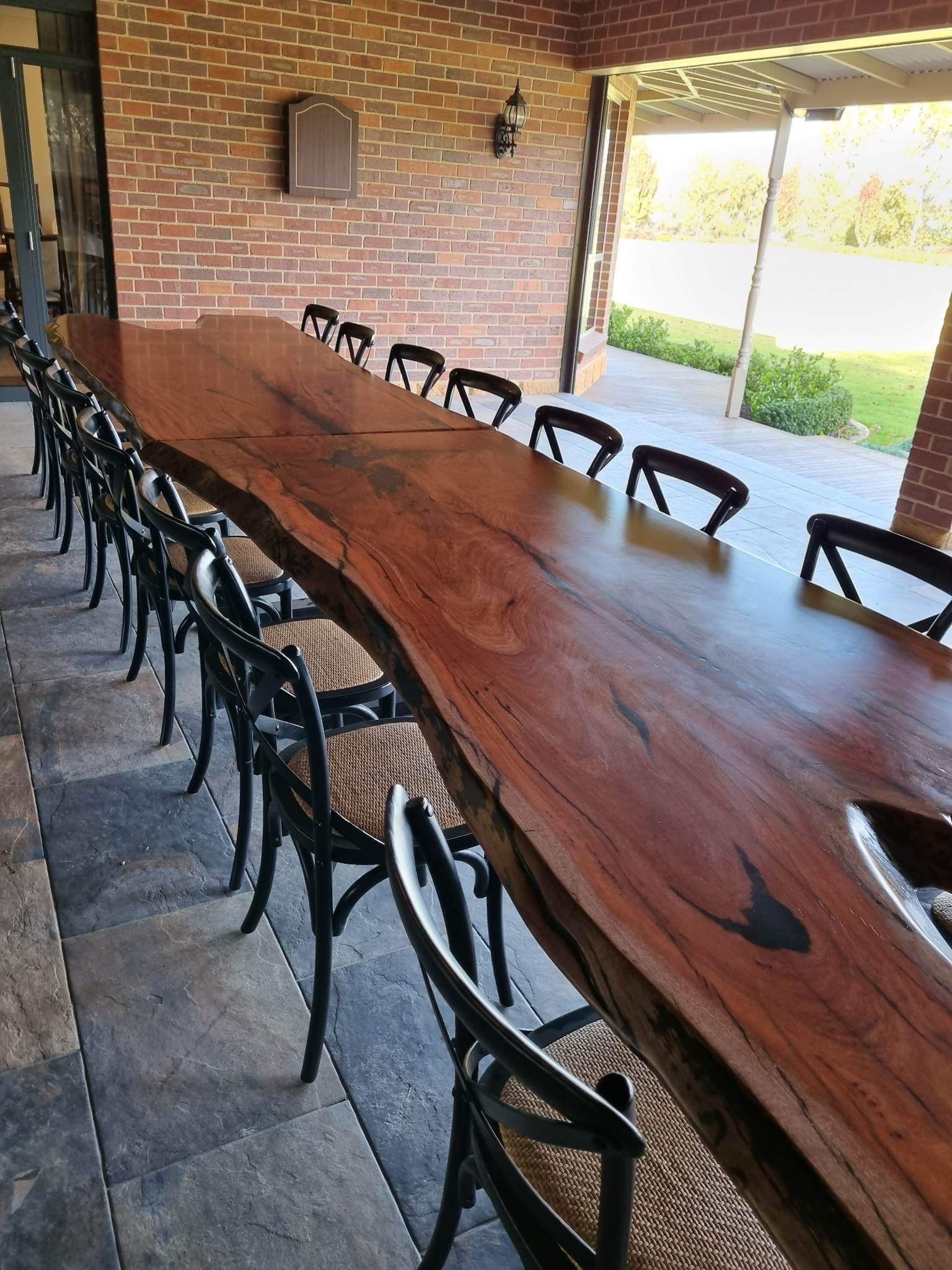 A Long Wooden Table With Chairs in a Living Room — Envisage Furniture in Kialla, VIC