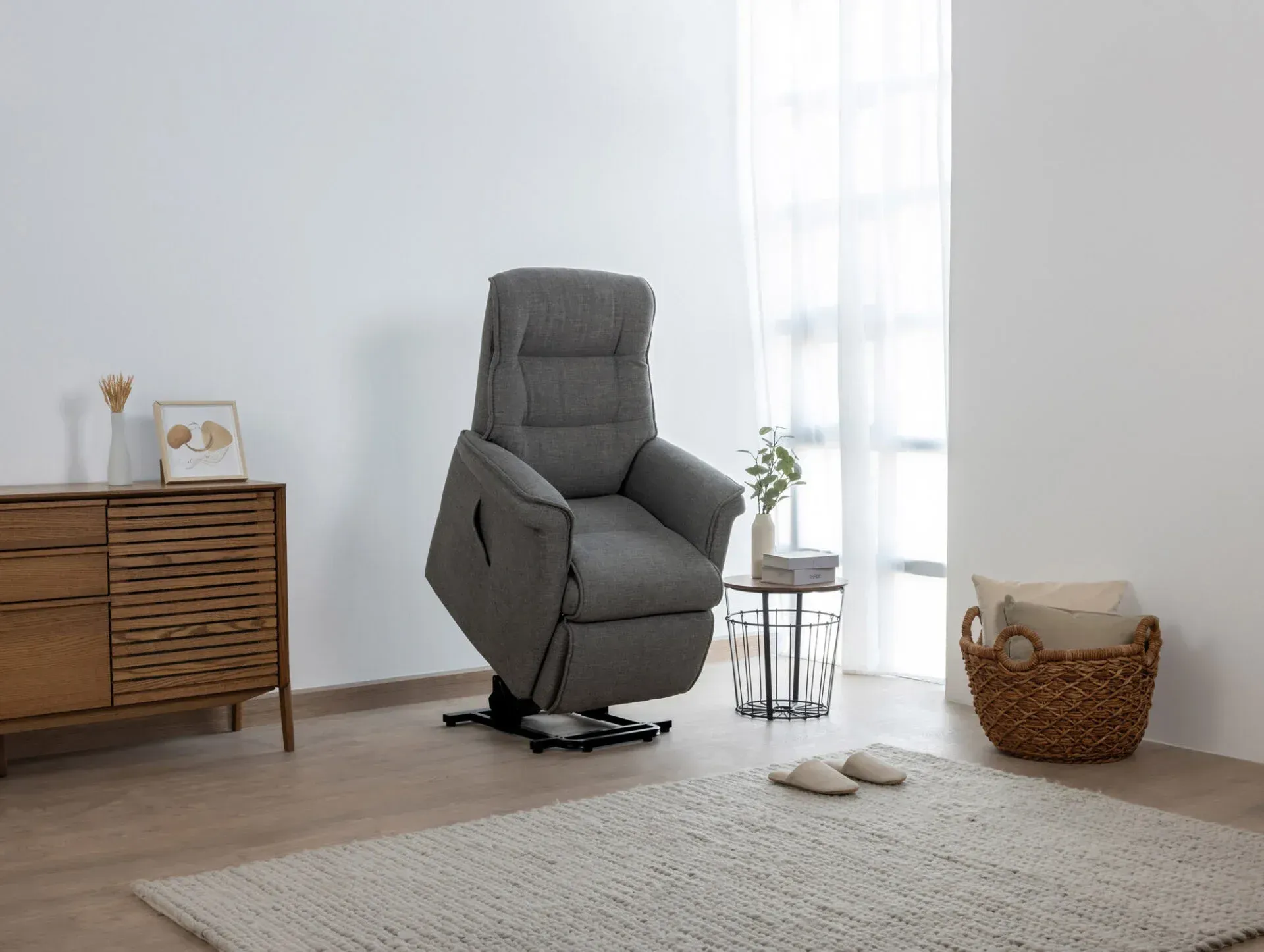 A Grey Recliner Is Sitting In A Living Room Next To A Window — Envisage Furniture in Kialla, VIC