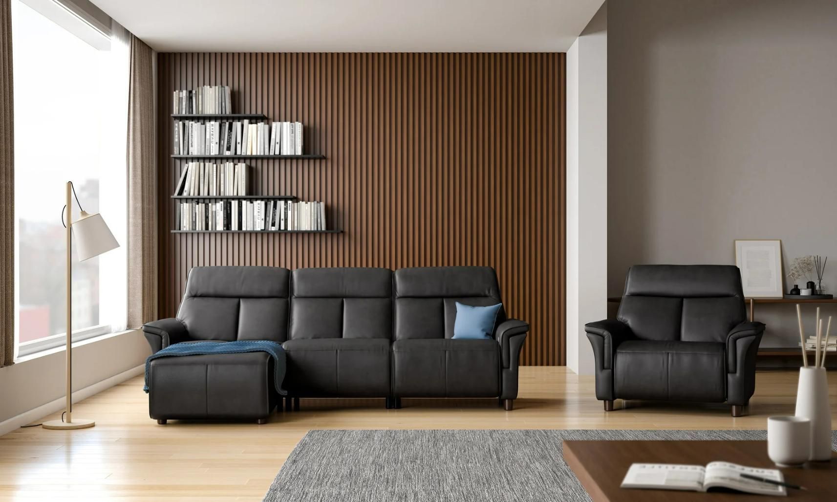 A Living Room With a Couch , Chair , Ottoman and Bookshelf — Envisage Furniture in Kialla, VIC