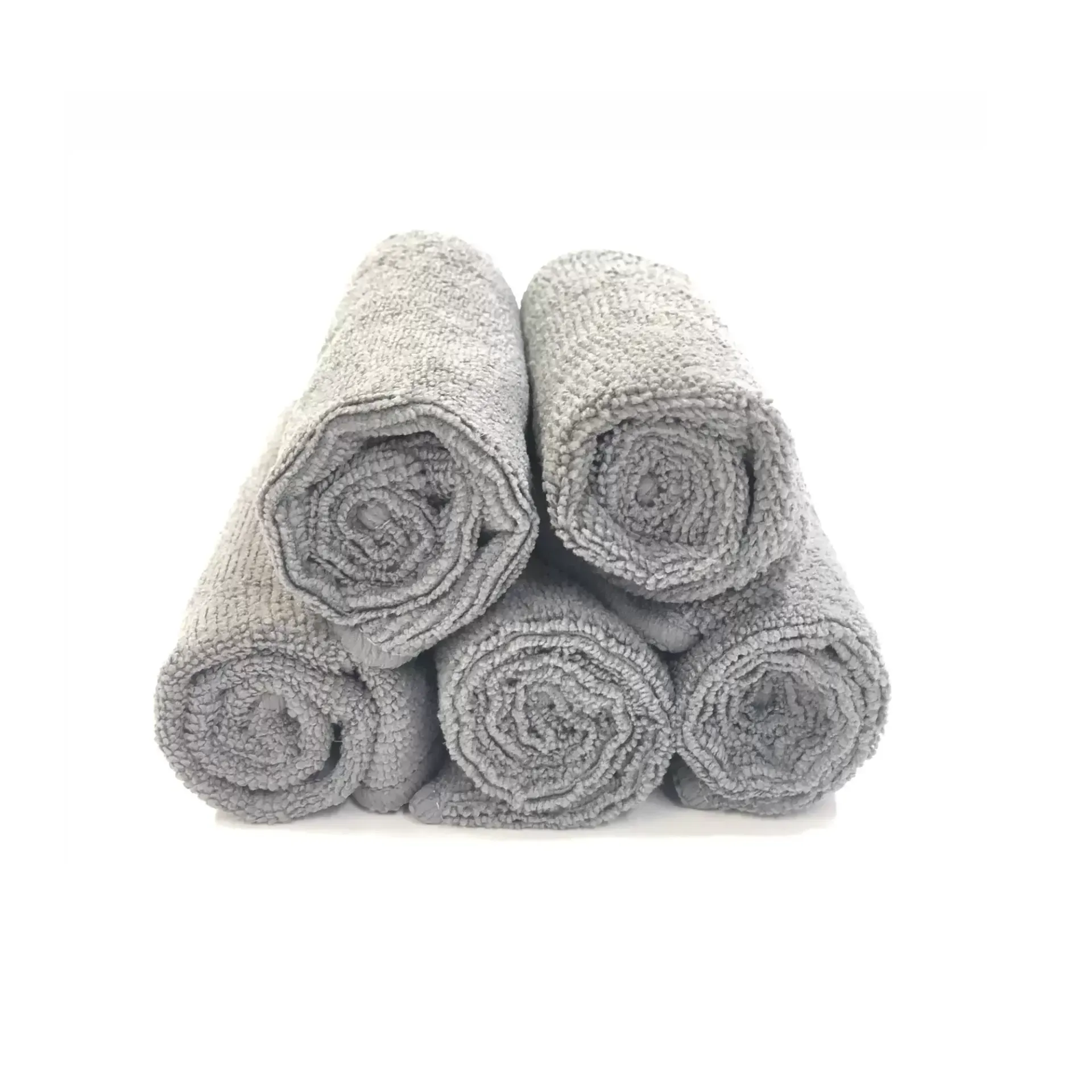 A Stack of Rolled Up Towels on a White Background — Envisage Furniture in Kialla, VIC