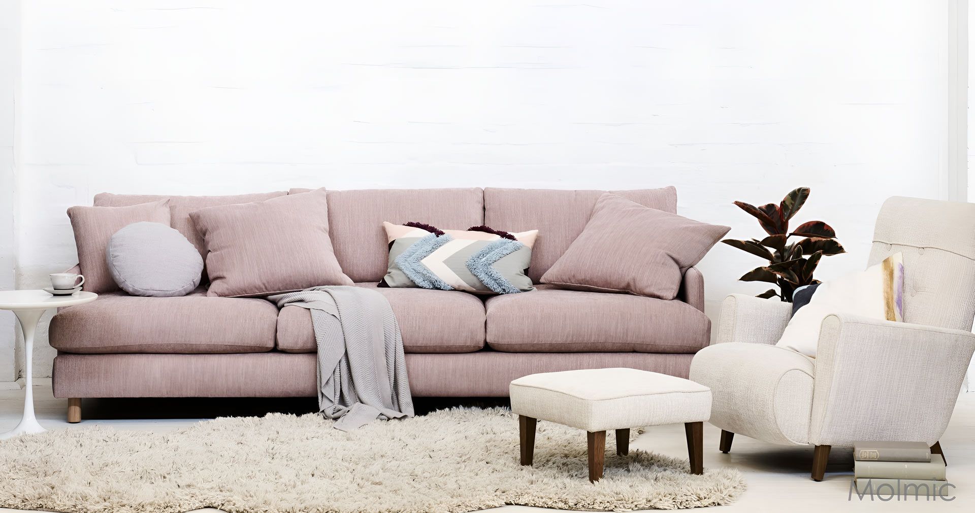 A Living Room With A Pink Couch, Chair And Ottoman — Envisage Furniture in Kialla, VIC