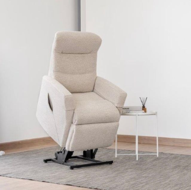 A Grey Leather Couch is Sitting on a Carpet in a Living Room — Envisage Furniture in Kialla, VIC