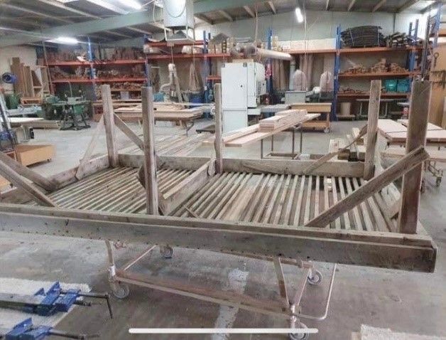 A Wooden Table With a Mattress on Top of It in a Room — Envisage Furniture in Kialla, VIC