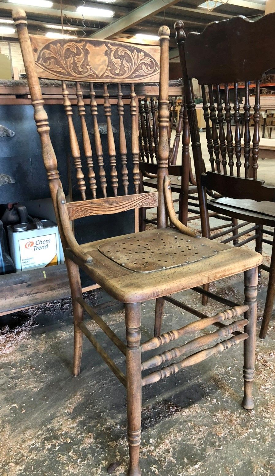 A Wooden Chair Is Sitting On Top Of A Wooden Table — Envisage Furniture in Kialla, VIC