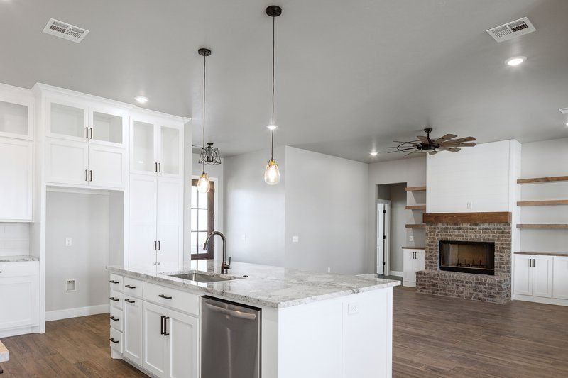 There is a large island in the middle of the kitchen.