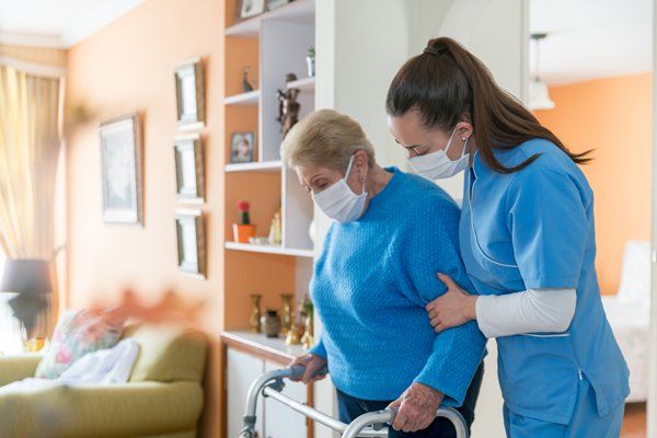 Elder Being Assisted by Healthcare Nurse — San Rafael, CA — Terra Linda Christian Homes Inc.