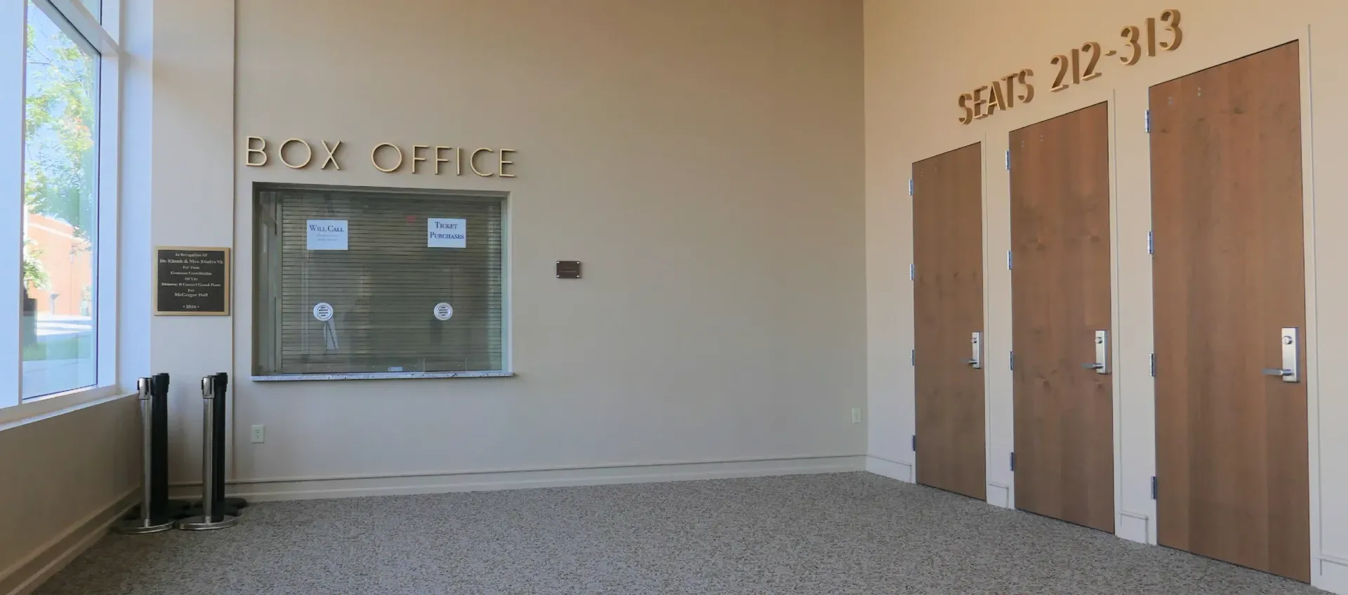 Box office and three doors labeled