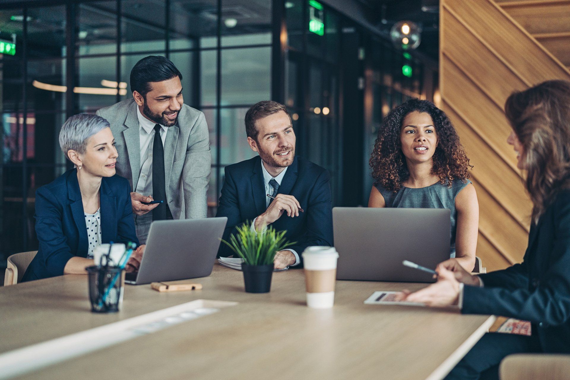 A group of people looking at a computer and make some discussion | Melbourne, VIC | Menzies Advisory
