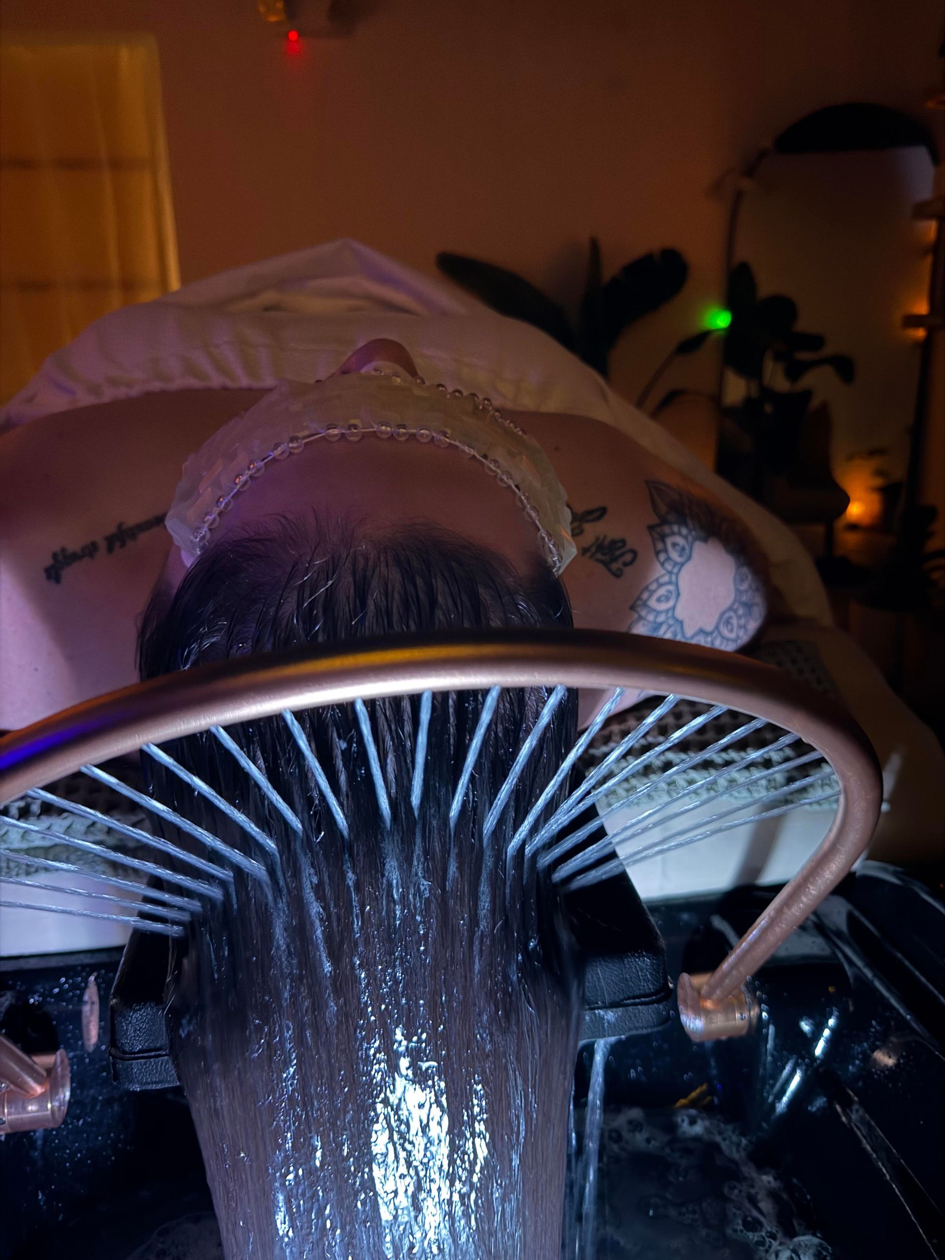 A woman is giving a woman a facial treatment in a spa.