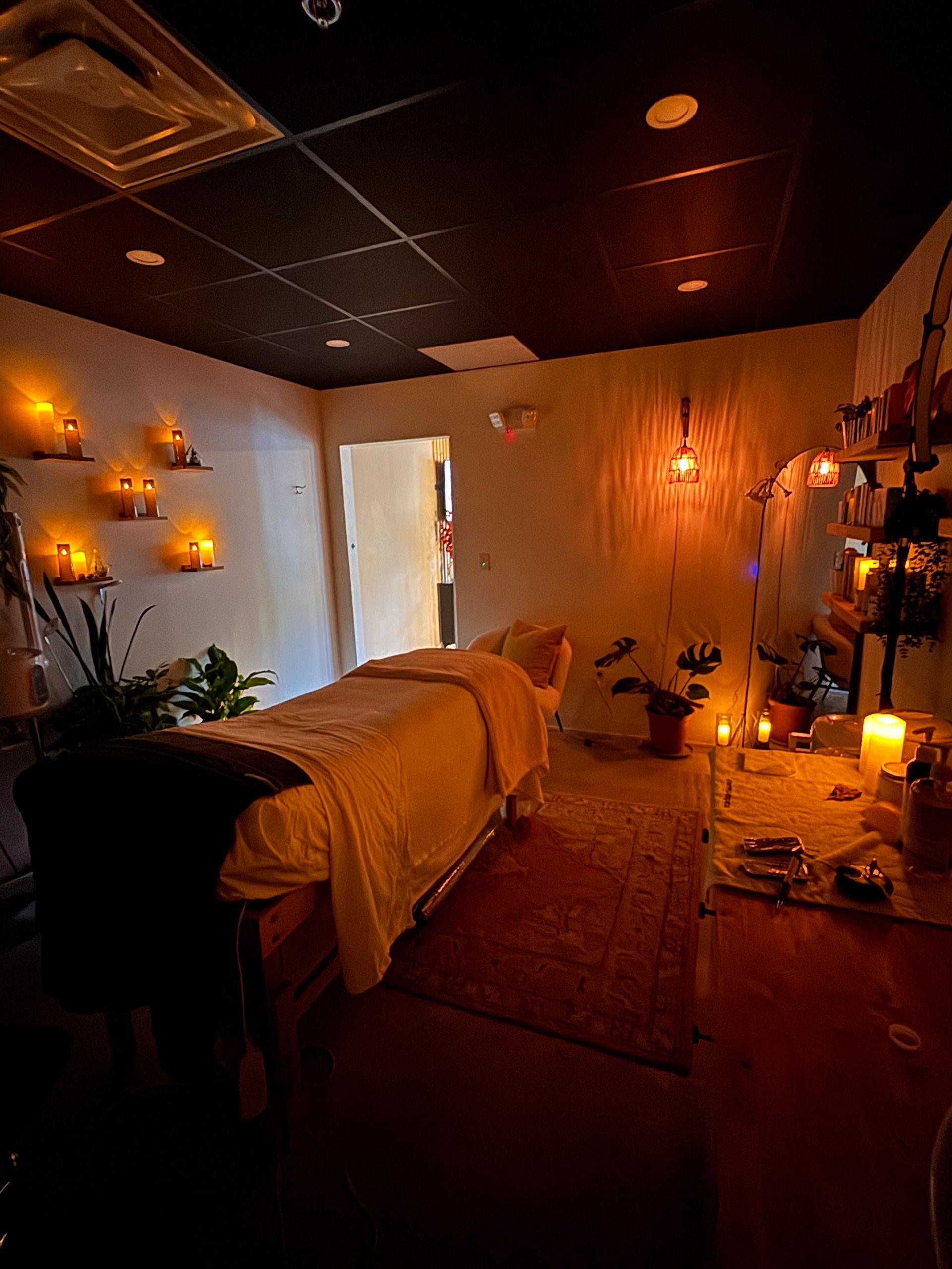A shelf filled with bottles of dermalogica products in a bathroom.