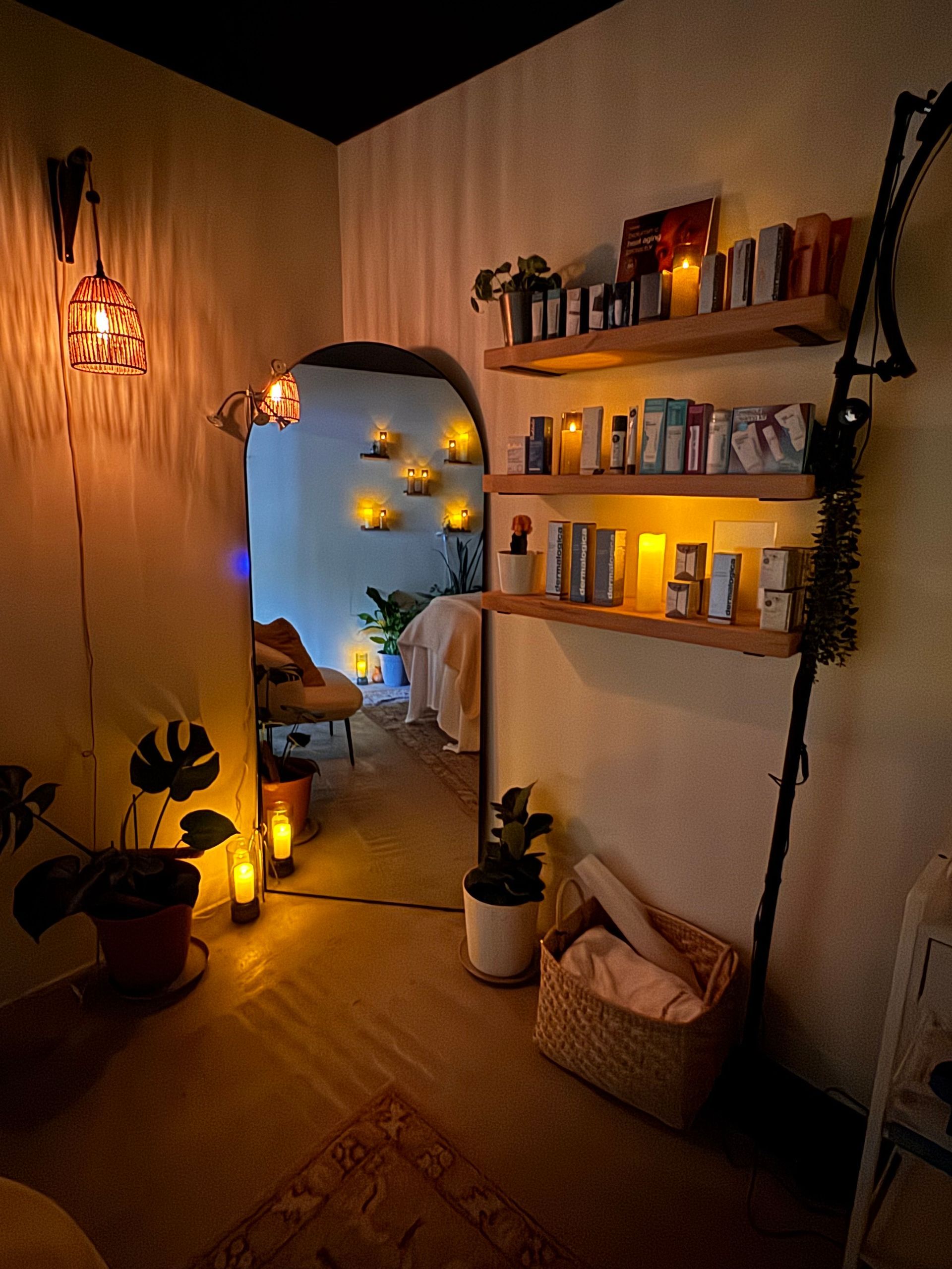 A woman is laying on a bed with a magazine on top of her.