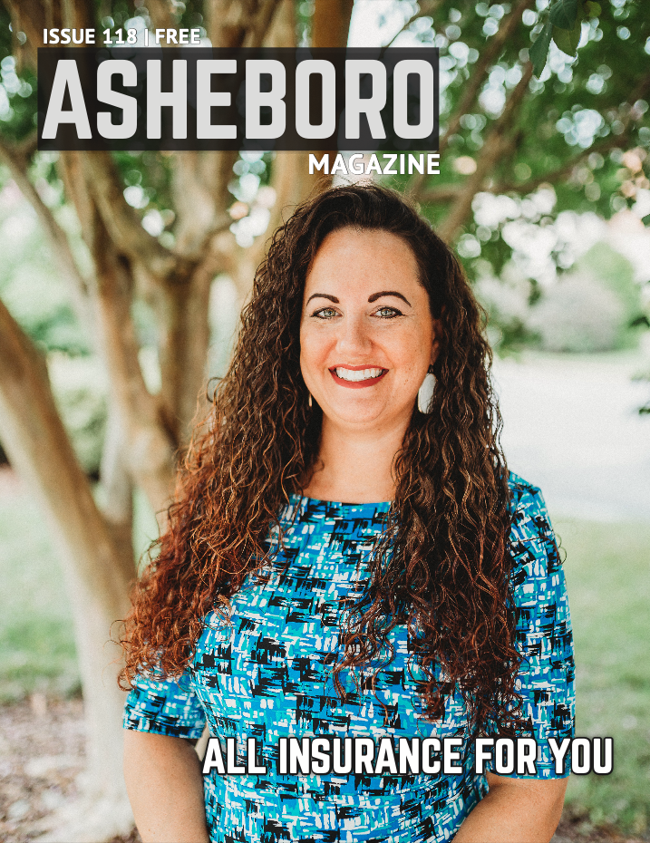 A woman is standing in front of a tree on the cover of a magazine.