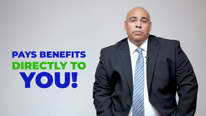 A man in a suit and tie is standing in front of a sign that says pays benefits directly to you