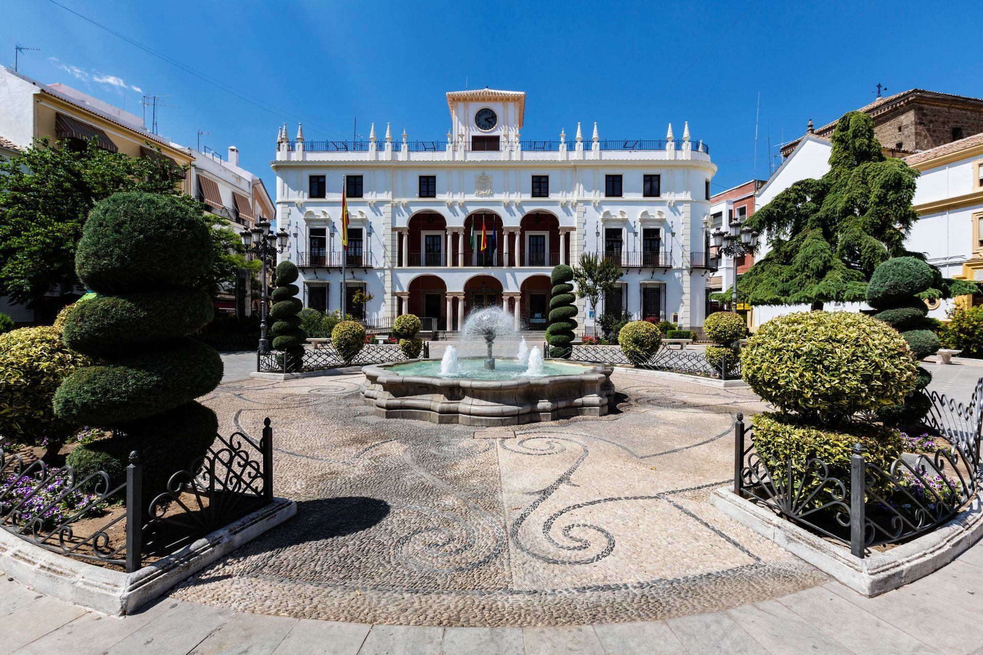 A Large White Building with A Fountain in Front of It — Dallas, TX — Delivery Limited